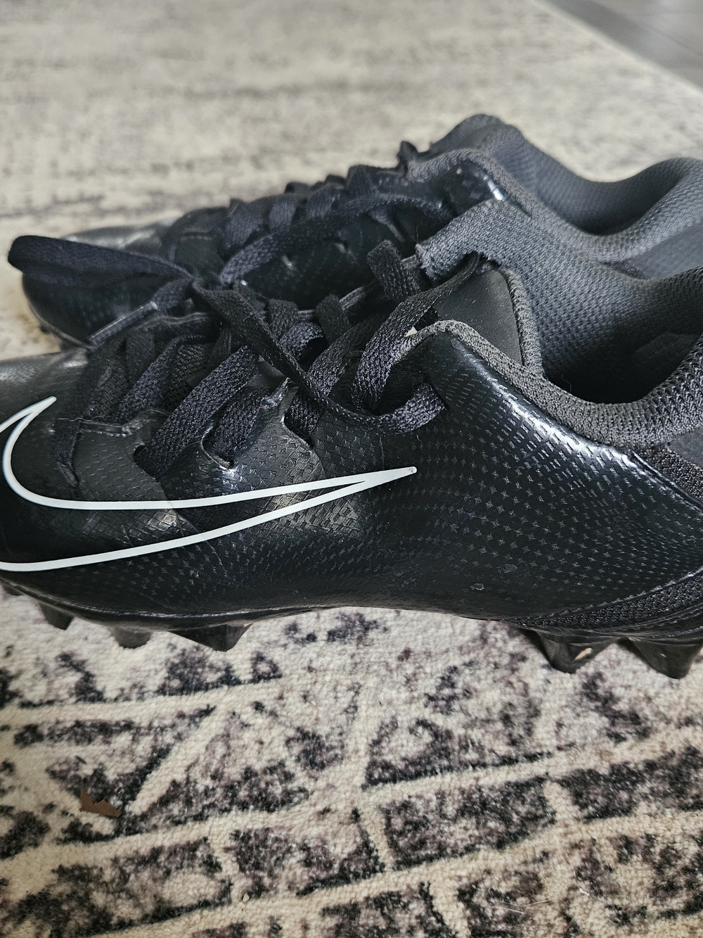 Nike Black Athletic Cleats with White Swoosh - Picture 2 of 4